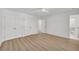 Bedroom featuring a closet, light hardwood floors, and an attached bathroom at 1 N Boundary Nw Pl, Atlanta, GA 30318