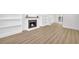 Spacious living room with a fireplace, built-in shelves, and hardwood floors at 1 N Boundary Nw Pl, Atlanta, GA 30318