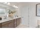 Stylish bathroom featuring double sinks with modern fixtures and a neutral color palette at 1455 Auburn Glen Rd, Dacula, GA 30019
