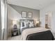 Comfortable bedroom featuring a stylish bed, patterned accent wall, and ample natural light at 1455 Auburn Glen Rd, Dacula, GA 30019