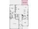 Open-concept first-floor plan features a kitchen, dining, and great room area plus a bedroom suite at 1455 Auburn Glen Rd, Dacula, GA 30019