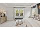 Bright primary bedroom suite, beautifully decorated with ample natural light and stylish furnishings at 1455 Auburn Glen Rd, Dacula, GA 30019