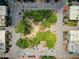 Overhead view of a charming city square with green spaces, surrounding shops, and street parking at 201 Rippling Nw Dr, Marietta, GA 30064
