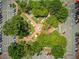An aerial view of a vibrant town square featuring a fountain and beautifully landscaped grounds, perfect for outdoor activities at 201 Rippling Nw Dr, Marietta, GA 30064