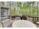 Enjoy outdoor living on this spacious back deck with wooded views at 201 Rippling Nw Dr, Marietta, GA 30064
