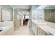 Modern bathroom features a walk-in shower, double vanity, and natural lighting at 201 Rippling Nw Dr, Marietta, GA 30064