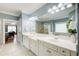 Elegant bathroom with double vanity, shower, and natural light at 201 Rippling Nw Dr, Marietta, GA 30064