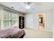Bedroom with a window, closet, and view into the bathroom at 201 Rippling Nw Dr, Marietta, GA 30064
