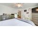 Bedroom with white walls, neutral carpet, a ceiling fan, and a view into the hallway at 201 Rippling Nw Dr, Marietta, GA 30064