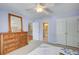 Serene bedroom with a wooden dresser, closet and an ensuite bathroom at 201 Rippling Nw Dr, Marietta, GA 30064