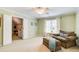 Cozy bedroom featuring a lounge chair, and double doors to another room at 201 Rippling Nw Dr, Marietta, GA 30064