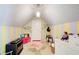 Playful bonus room with colorful decor, artful design and sloped ceilings at 201 Rippling Nw Dr, Marietta, GA 30064