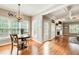 Sunlit breakfast area adjacent to the kitchen with hardwood floors at 201 Rippling Nw Dr, Marietta, GA 30064