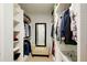 Well-organized walk-in closet with shelving, mirror, and ample storage space at 201 Rippling Nw Dr, Marietta, GA 30064