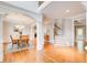 Spacious dining room with hardwood floors, decorative columns, and elegant lighting, creating a perfect space to gather at 201 Rippling Nw Dr, Marietta, GA 30064