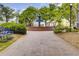 Beautiful tiered fountain set against lush trees, creates a serene and inviting atmosphere in this green space at 201 Rippling Nw Dr, Marietta, GA 30064