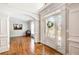 Elegant foyer with hardwood floors, decorative columns, and a view into a living room, creating a grand entrance at 201 Rippling Nw Dr, Marietta, GA 30064