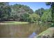 Picturesque lake with a gazebo and picnic area, ideal for outdoor gatherings and leisure at 201 Rippling Nw Dr, Marietta, GA 30064