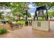 Replica of the Liberty Bell located in a downtown park with benches and flowers, perfect for community gatherings at 201 Rippling Nw Dr, Marietta, GA 30064