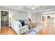 Bright living room featuring hardwood floors and an elegant coffered ceiling at 201 Rippling Nw Dr, Marietta, GA 30064