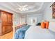 Relaxing primary bedroom featuring tray ceiling, ceiling fan, and closet access at 201 Rippling Nw Dr, Marietta, GA 30064