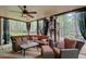 Comfortable outdoor living space with plush seating and a ceiling fan for added comfort at 201 Rippling Nw Dr, Marietta, GA 30064