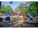 Colorful community playground featuring slides, climbing structures, and safe, soft ground cover at 201 Rippling Nw Dr, Marietta, GA 30064