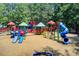 Large community playground with colorful play structures and a soft ground surface for safety at 201 Rippling Nw Dr, Marietta, GA 30064
