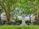 Historic statue surrounded by lush greenery and park benches in a serene setting at 201 Rippling Nw Dr, Marietta, GA 30064