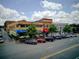 Street view of restaurants and local businesses, complemented by street parking under a bright, cloudy sky at 201 Rippling Nw Dr, Marietta, GA 30064