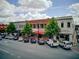 Street view of local businesses and shops with convenient street parking on a sunny day at 201 Rippling Nw Dr, Marietta, GA 30064