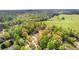 Expansive aerial view of a lush green neighborhood with mature trees and well-maintained homes at 530 S Lost Lake Cv, Villa Rica, GA 30180