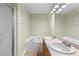 Bright bathroom with tub, shower, double sinks, and large mirror at 530 S Lost Lake Cv, Villa Rica, GA 30180