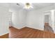 Comfortable bedroom with wood-look floors, a window, and neutral walls at 530 S Lost Lake Cv, Villa Rica, GA 30180
