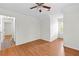 Spacious bedroom with wood-look flooring and a ceiling fan, ready for personalization at 530 S Lost Lake Cv, Villa Rica, GA 30180