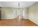 Light dining room with hardwood floors, elegant lighting, and natural light at 530 S Lost Lake Cv, Villa Rica, GA 30180