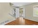 Inviting foyer with hardwood floors, staircase, and front door leading to the porch at 530 S Lost Lake Cv, Villa Rica, GA 30180
