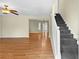 Spacious living room featuring hardwood floors, a staircase and neutral paint at 530 S Lost Lake Cv, Villa Rica, GA 30180