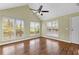 Sunlit living room featuring vaulted ceiling, large windows, and hardwood floors at 530 S Lost Lake Cv, Villa Rica, GA 30180