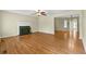 Inviting living room boasts hardwood floors, fireplace, and French doors to another room at 530 S Lost Lake Cv, Villa Rica, GA 30180