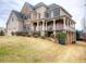 Beautiful two-story home with stone accents, covered porch, and a well-maintained lawn at 5610 Hollowbrooke Ln, Acworth, GA 30101