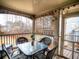 Cozy screened porch with outdoor seating, perfect for relaxation and enjoying the views at 5610 Hollowbrooke Ln, Acworth, GA 30101