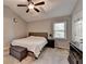 Neutral bedroom with a ceiling fan, a queen bed, a dresser, a window, and a storage ottoman at 6040 Carriage Dr, Cumming, GA 30028