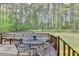 Outdoor deck features a charming bench and outdoor seating area with backyard views at 6040 Carriage Dr, Cumming, GA 30028