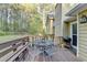 Outdoor deck features a charming bench, grill, and outdoor seating area at 6040 Carriage Dr, Cumming, GA 30028