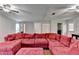 Bright living room with hardwood floors, large sectional, ceiling fans and lots of natural light at 6040 Carriage Dr, Cumming, GA 30028