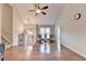 Spacious living room with gleaming hardwood floors, high ceilings, and an abundance of natural light at 6040 Carriage Dr, Cumming, GA 30028