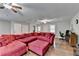 Hardwood floors and a large sectional make this a great space for entertaining at 6040 Carriage Dr, Cumming, GA 30028