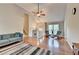 Bright and airy living room with vaulted ceilings, hardwood floors, and an open layout at 6040 Carriage Dr, Cumming, GA 30028