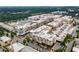 Aerial view of a vibrant mixed-use development with apartments, shops, and ample parking at 12120 Dancliff Trce, Alpharetta, GA 30009